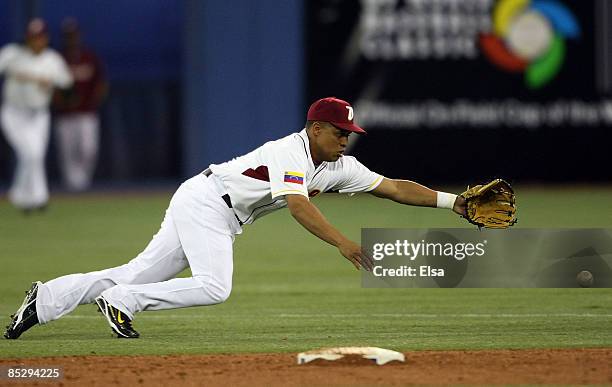 Cesar Izturis of Venezuela misses the ball against Italy during the 2009 World Baseball Classic Pool C match on March 7, 2009 at the Rogers Center in...