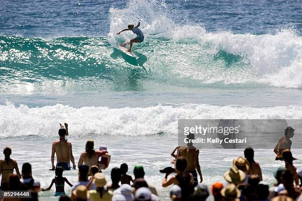 Stephanie Gilmore of Australia cuts back a wave infront of a packed Snapper Rocks beach during the final of the Roxy Pro Gold Coast presented by LG...