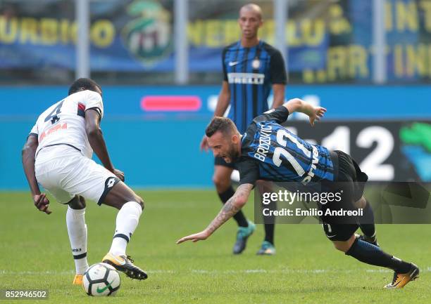 Marcelo Brozovic of FC Internazionale Milano is challenged by Isaac Cofie of Genoa CFC during the Serie A match between FC Internazionale and Genoa...