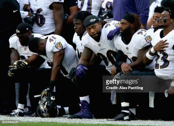 Baltimore Ravens players kneel for the American National anthem during the NFL International Series match between Baltimore Ravens and Jacksonville...