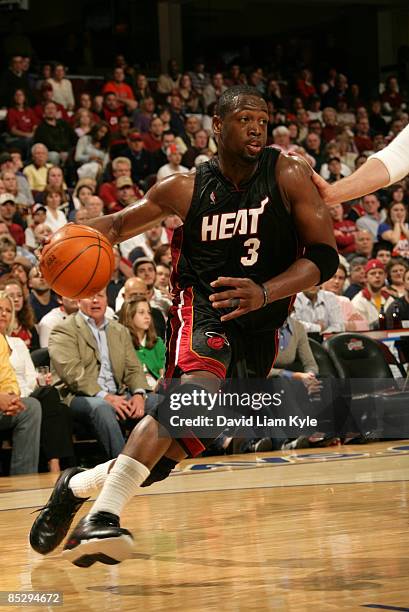 Dwyane Wade of the Miami Heat drives to the basket against the Cleveland Cavaliers at The Quicken Loans Arena on March 7, 2009 in Cleveland, Ohio....