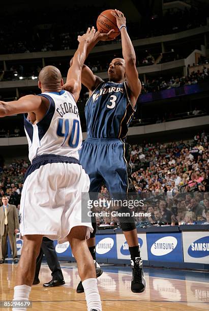 Caron Butler of the Washington Wizards goes up for a jumper against Devean George of the Dallas Mavericks on March 7, 2009 at the American Airlines...