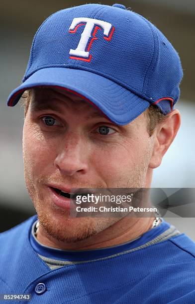 Josh Hamilton of the Texas Rangers stands in the dugout during the spring training game against the San Diego Padres at Surprise Stadium on March 5,...