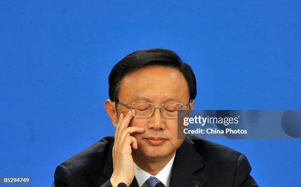 Chinese Foreign Minister Yang Jiechi attends a press conference held on the sideline of the second session of the 11th National People's Congress on...