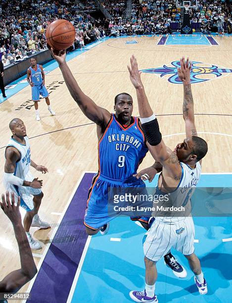 Malik Rose of the Oklahoma City Thunder shoots over Tyson Chandler of the New Orleans Hornets on March 7, 2009 at the New Orleans Arena in New...