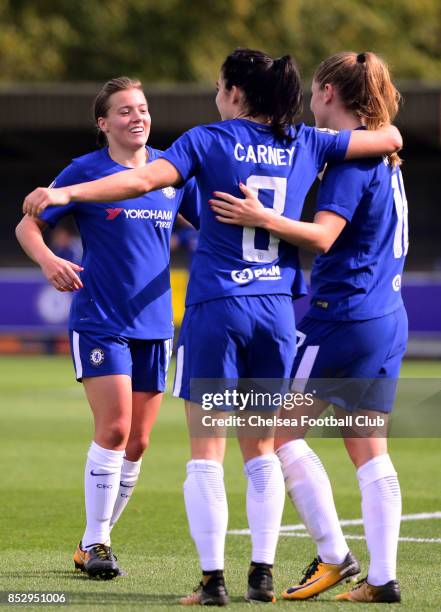 Karen Carney and Fran Kirby of Chelsea congratulate team mate Maren Mjelde after she scores to put their side 3-0 up of during a WSL Match between...