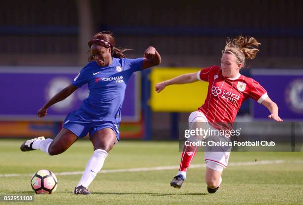 Eniola Aluko of Chelsea takes a shot on goal as frankie Brown tries to block her during a WSL Match between Chelsea Ladies and Bristol Academy Women...