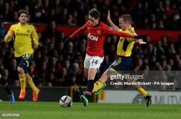 Manchester United's Adnan Januzaj battles for the ball with Sunderland's Lee Cattermole during the Capital One Cup, Semi Final, Second Leg at Old...