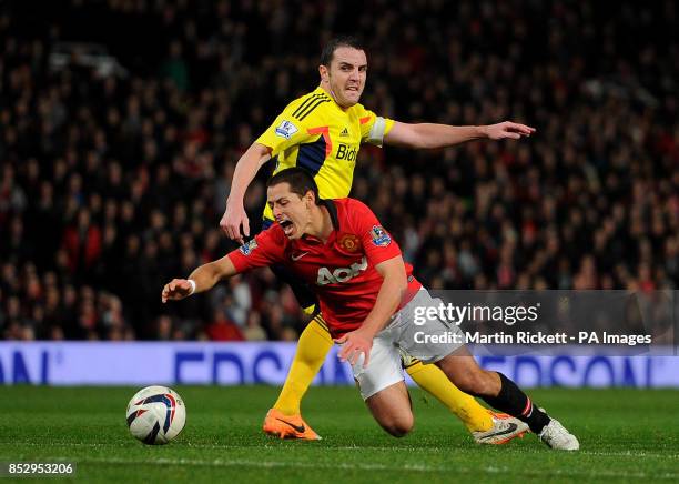 Manchester United's Javier Hernandez is fouled by Sunderland's John O'Shea during the Capital One Cup, Semi Final, Second Leg at Old Trafford,...