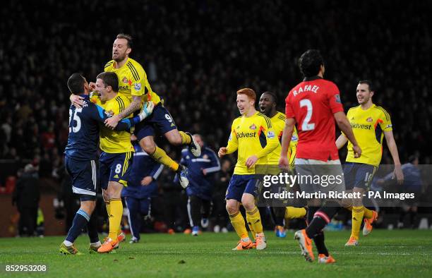 Sunderland's Vito Mannone celebrates with Craig Gardner after Manchester United's Rafael Da Silva's missed penalty during the Capital One Cup, Semi...