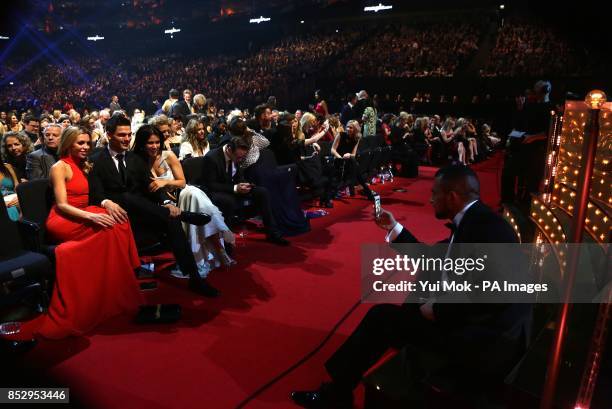 Abbey Clancey, Aljaz Skorjanec and Susannah Reid have their photograph taken by Robin Windsor during the 2014 National Television Awards at the O2...