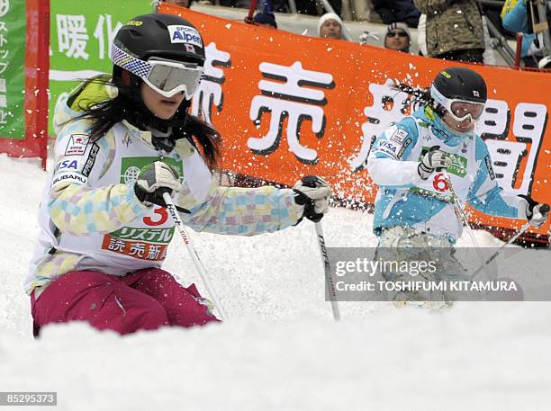 Aiko Uemura of Japan leads compatriot Miki Ito during their final heat of the women's dual mogul final rounds in the 2009 FIS Freestyle World...