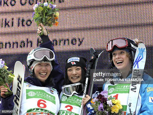 Women's dual mogul winner Aiko Uemura of Japan poses with second placed compatriot Miki Ito and 3rd placed Hannah Kearney of the US on the podium of...