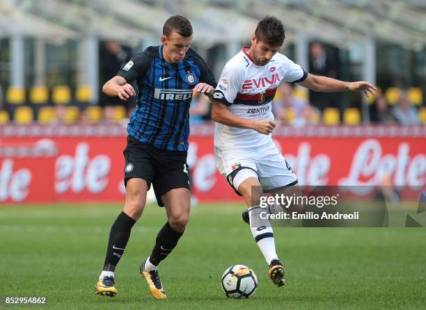 Ivan Perisic of FC Internazionale Milano competes for the ball with Miguel Veloso of Genoa CFC during the Serie A match between FC Internazionale and...