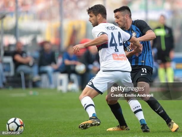 Matias Vecino of FC Internazionale Milano competes for the ball with Miguel Veloso of Genoa CFC during the Serie A match between FC Internazionale...