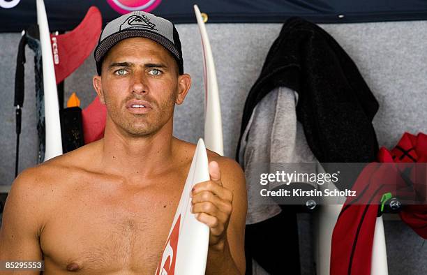 World Champion and defending Quiksilver Pro Champion Kelly Slater of the United States of America watches the surfing from the competitors area while...