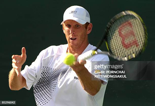 Australia tennis player Chris Guccione views the ball as he returns to Kittipong Wachiramanowong of Thailand during the Davis Cup Asia/Oceania Zone...