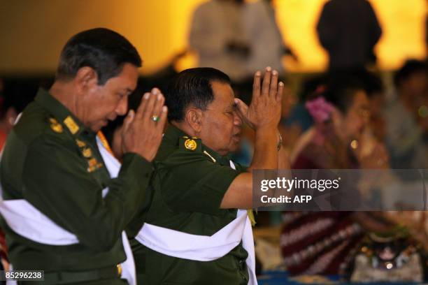 Myanmar leader General Than Shwe offers prayers during a consecration ceremony of the Uppatasanti Pagoda, a replica of Yangon's famed Shwedagon...