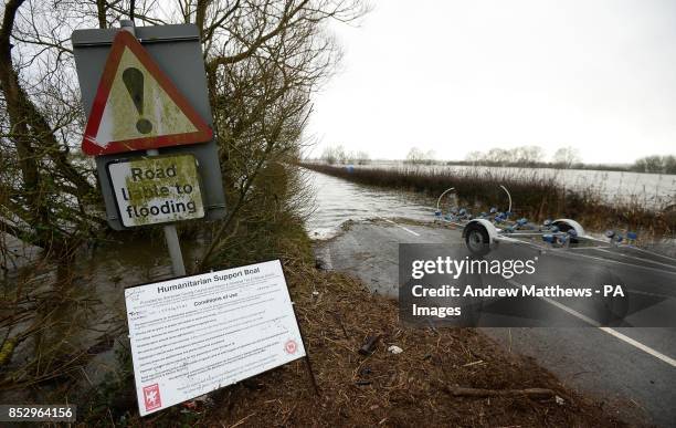 View of flood water on Law Lane which connects Muchelney in Somerset to nearby Langport.