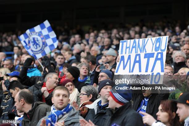 Chelsea fan in the stands holds up a banner thanking Juan Mata for his service to the club