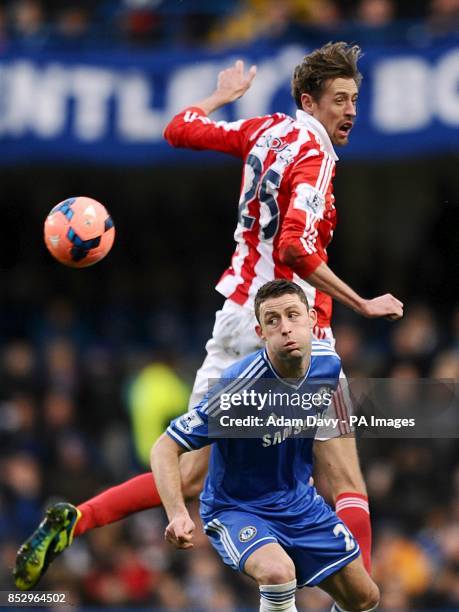 Chelsea's Gary Cahill and Stoke City's Peter Crouch battle for the ball