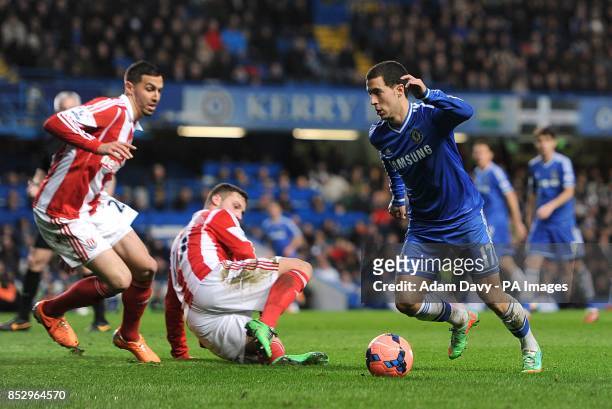 Chelsea's Eden Hazard looks to go around Stoke City's Marko Arnautovic and Geoff Cameron as they battle for the ball
