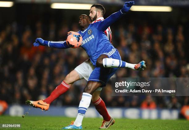 Stoke City's Marc Wilson and Chelsea's Demba Ba battle for the ball