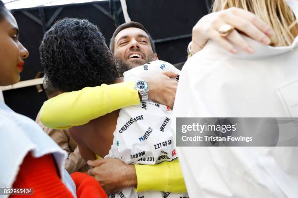 Massimo Giorgetti and a model are seen backstage ahead of the MSGM show during Milan Fashion Week Spring/Summer 2018on September 24, 2017 in Milan,...