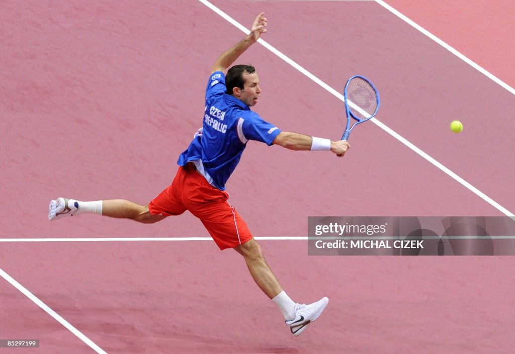 Steven Radek Radek Stepanek of Czech Republic returns a ball to Gilles Simon of ...