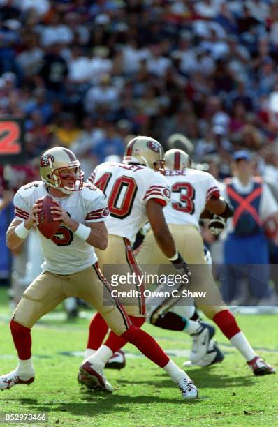 Jeff Garcia of the San Francisco 49ers drops back to pass against the San Diego Chargers at Jack Murphy Stadium circa 2002 in San Diego,California.
