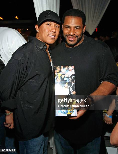 Hines Ward of the Pittsburgh Steelers and NFL analyst and former Pittsburgh Steelers running back Jerome Bettis display a Jose Cuervo Platino box...