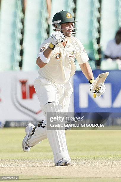 Australian batsman Phillip Hughes raises his fist as he celebrates scoring his century, the second one of the Test, on March 8, 2009 during the third...