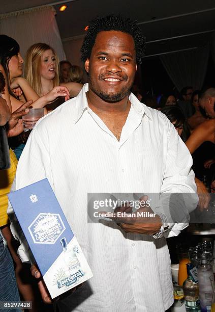 Player Melvin Fowler holds a Jose Cuervo Platino box at NFL analyst and former Pittsburgh Steelers running back Jerome Bettis' birthday party,...