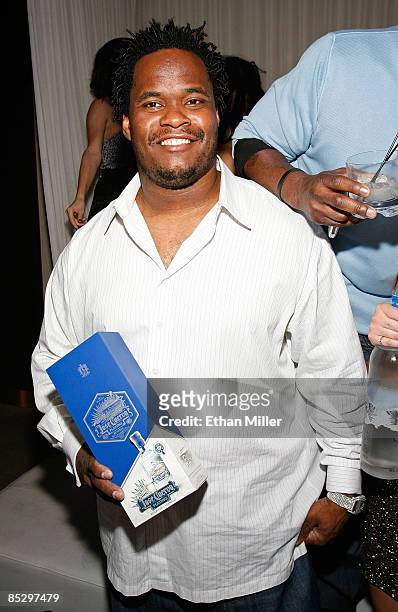 Player Melvin Fowler holds a Jose Cuervo Platino box at NFL analyst and former Pittsburgh Steelers running back Jerome Bettis' birthday party,...