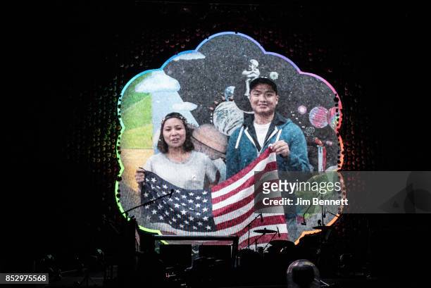 Fans introduce Coldplay on the video screen before their live performance at CenturyLink Field on September 23, 2017 in Seattle, Washington.