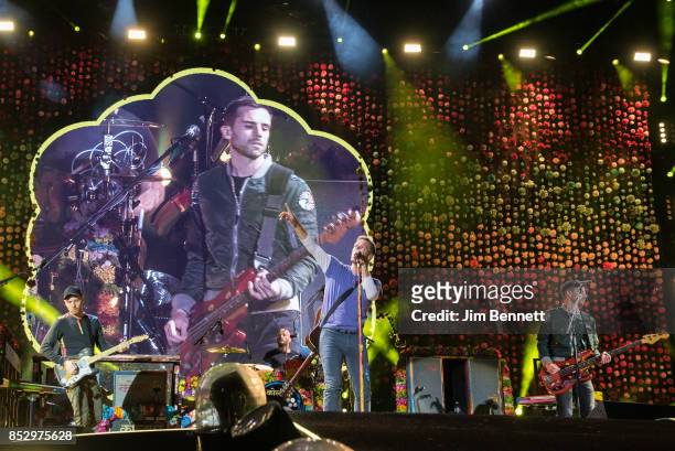 Jonny Buckland , Will Champion, Chris Martin and Guy Berryman of Coldplay perform live on stage at CenturyLink Field on September 23, 2017 in...
