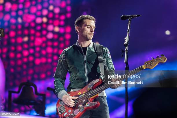 Guy Berryman of Coldplay performs live on stage at CenturyLink Field on September 23, 2017 in Seattle, Washington.