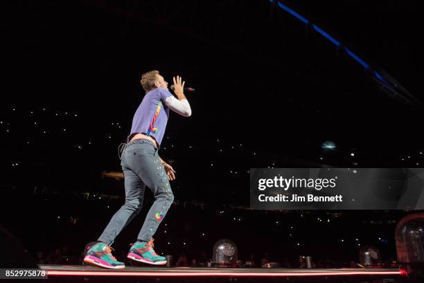 Chris Martin of Coldplay performs live on stage at CenturyLink Field on September 23, 2017 in Seattle, Washington.