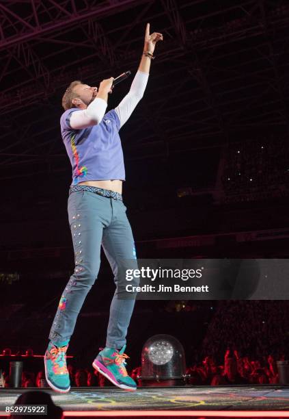 Chris Martin of Coldplay performs live on stage at CenturyLink Field on September 23, 2017 in Seattle, Washington.