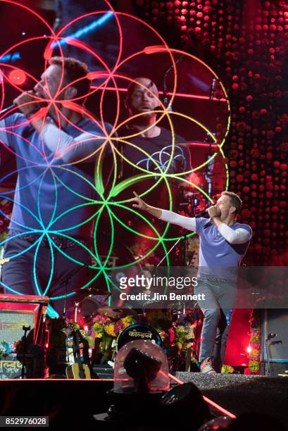 Drummer Will Champion and singer/guitarist/pianist Chris Martin of Coldplay perform live on stage at CenturyLink Field on September 23, 2017 in...