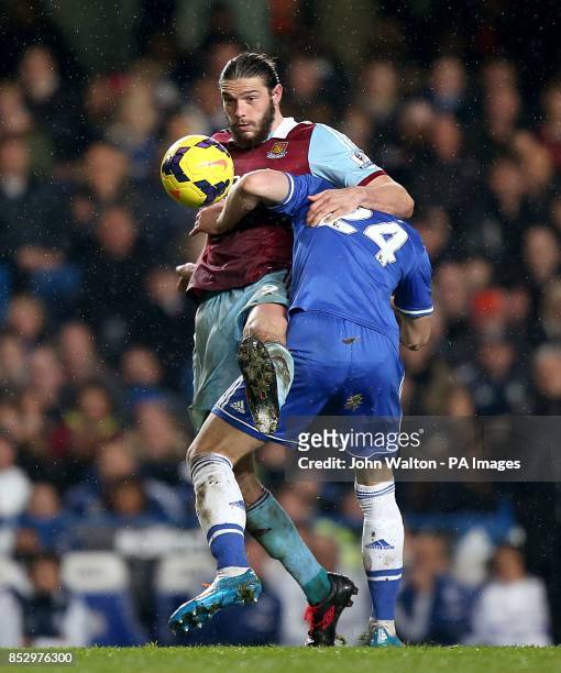 West Ham United's Andy Carroll and Chelsea's Gary Cahill battle for the ball