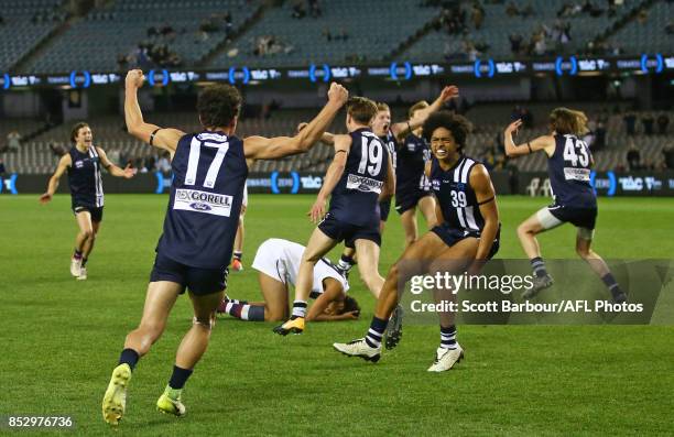 Geelong players celebrate after Joel Amartey of the Sandringham Dragons missed a shot at goal after the siren during the TAC Cup Grand Final match...
