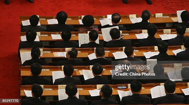 Delegates attend the third plenary meeting of the Second Session of the 11th CPPCC National Committee at the Great Hall of the People on March 8,...