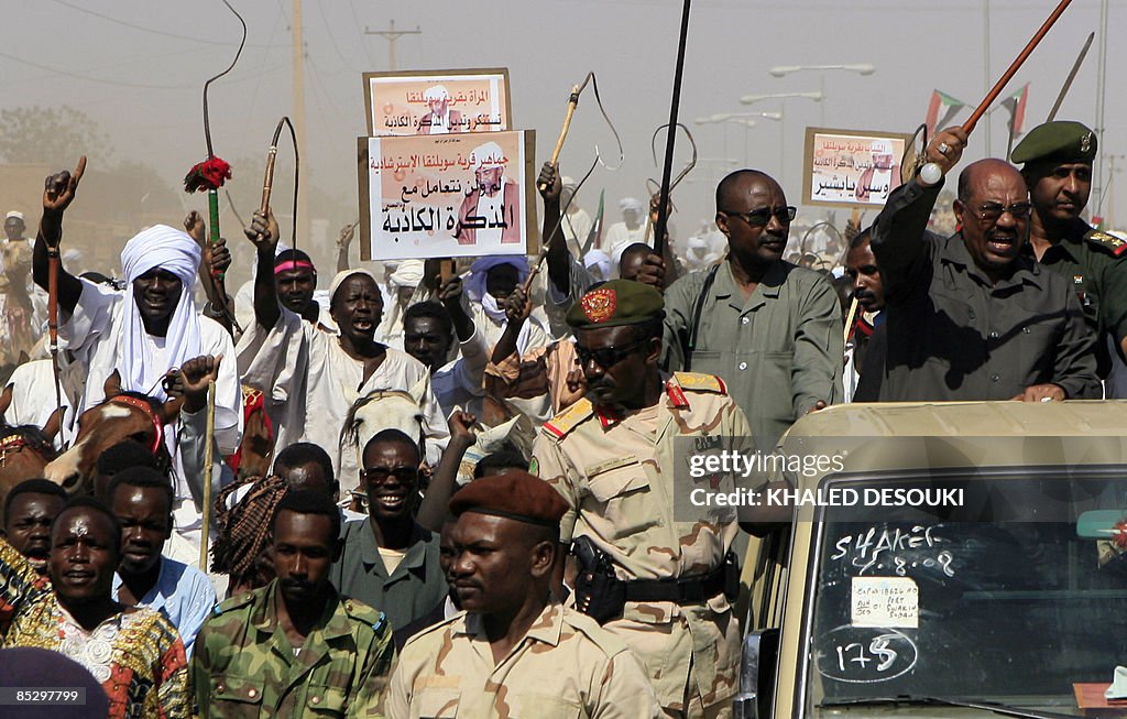 Sudanese President Omar al-Beshir (front