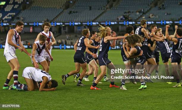 Geelong players celebrate after Joel Amartey of the Sandringham Dragons missed a shot at goal after the siren during the TAC Cup Grand Final match...