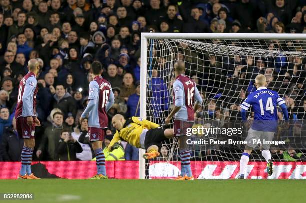 Players turn to watch Aston Villa goalkeeper Bradley Guzan fail to stop Everton's Kevin Mirallas from scoring their second goal of the game