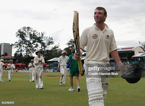 Phil Hughes of Australia leaves the field at the close of play during day three of the Second Test between South Africa and Australia played at...