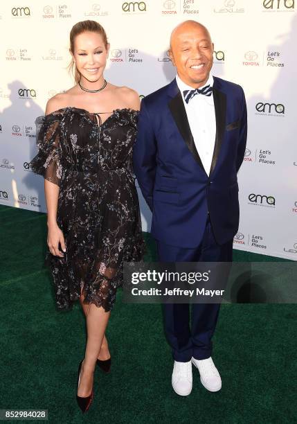 Model Kennedy Summers and entrepreneur-producer Russell Simmons arrive at the 27th Annual EMA Awards at Barker Hangar on September 23, 2017 in Santa...