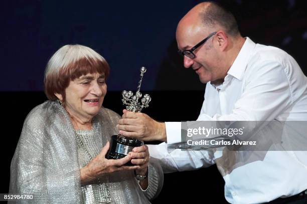 Director Agnes Varda receives from Jose Luis Rebordinos he Donosti Award during the 65th San Sebastian International Film Internacional Festival at...