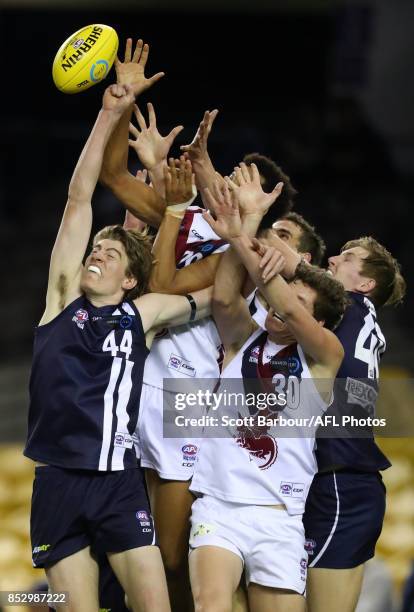 Joel Amartey of the Dragons and Sam Conway of the Geelong Falcons compete for the ball during the TAC Cup Grand Final match between Geelong and...